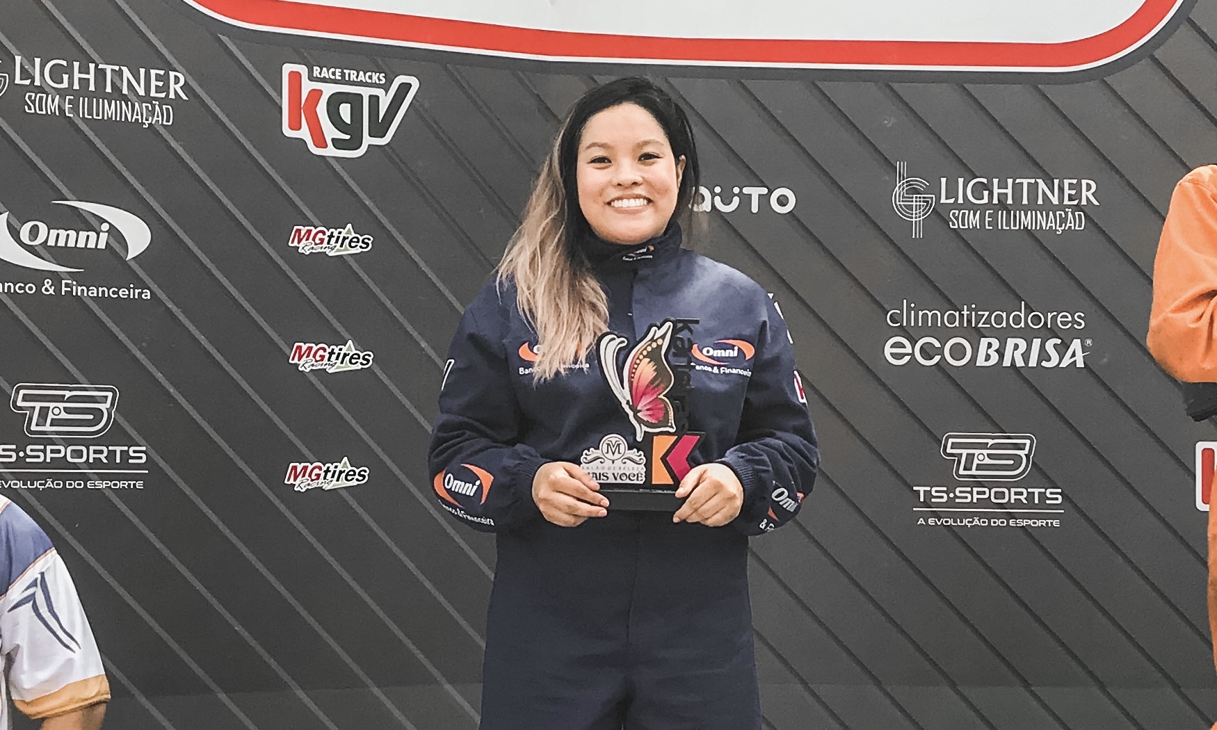 Tillie's photo with a trophe in her first amateur kart racing championship